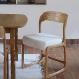 Lot de 4 chaises Baumann modèle Bémol en bois clair finition mate avec assises épaisses retapissées en bouclette écru.