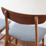 4 chaises scandinaves Farstrup en teck avec assise en tissu gris, design danois des années 60.