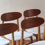 Six chaises scandinaves en hêtre et dossier teck, fabrication danoise des années 60, retapissées en bouclette écrue.