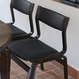 Suite de 6 chaises danoises vintage années 60, bois teinté brun, pieds arrière cintrés filant jusqu'au dossier bandeau, assises et dossiers retapissés en skaï noir