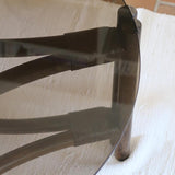 Table basse ronde en rotin et verre fumé — années 70