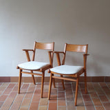 Paire de fauteuils vintage en bois et assise retapissée — années 60