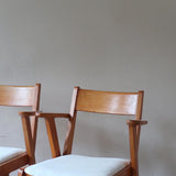 Paire de fauteuils vintage en bois et assise retapissée — années 60