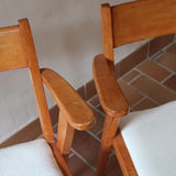 Paire de fauteuils vintage en bois et assise retapissée — années 60