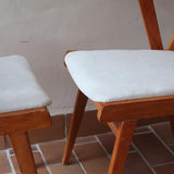 Paire de fauteuils vintage en bois et assise retapissée — années 60