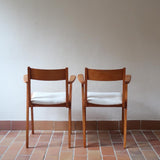 Paire de fauteuils vintage en bois et assise retapissée — années 60