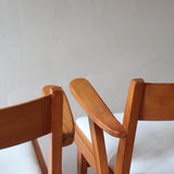 Paire de fauteuils vintage en bois et assise retapissée — années 60