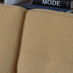 Canapé 3 places scandinave en teck des années 60 avec coussins en tissu jaune moutarde et structure type banquette.