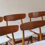 Ensemble 6 chaises scandinaves Farstrup teck années 60, dossiers teck courbé bandeau, structures bois clair, assises tissu bouclette écru refaites, danois mid-century