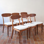 Suite de 6 chaises scandinaves vintage années 60, dossier galbé en teck, structure hêtre, assises retapissées en bouclette blanche