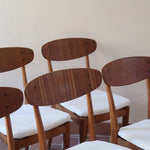 Suite de 6 chaises scandinaves vintage années 60, dossier galbé en teck, structure hêtre, assises retapissées en bouclette blanche