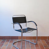 Fauteuil cantilever vintage chrome skaï noir – style Bauhaus