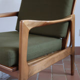 Fauteuil danois vintage en bois sculpté avec assise vert olive, design organique des années 60.