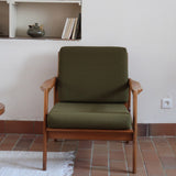 Fauteuil danois vintage en bois sculpté avec assise vert olive, design organique des années 60.