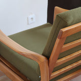 Fauteuil danois vintage en bois sculpté avec assise vert olive, design organique des années 60.