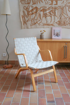 Fauteuil lounge en chêne avec assise et dossier en sangles tissées claires, design danois années 50
