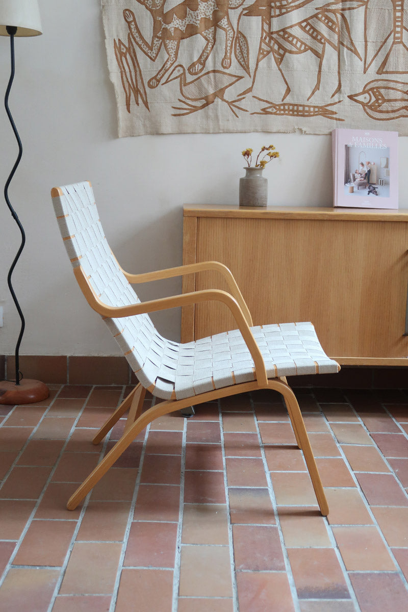 Fauteuil lounge en chêne avec assise et dossier en sangles tissées claires, design danois années 50