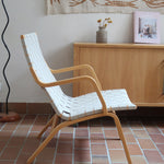 Fauteuil lounge en chêne avec assise et dossier en sangles tissées claires, design danois années 50