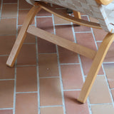 Fauteuil lounge en chêne avec assise et dossier en sangles tissées claires, design danois années 50