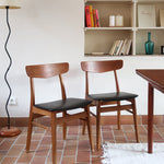 Paire de chaises scandinaves Farstrup en teck avec assise en skaï noir, design danois des années 60.