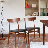 Paire de chaises scandinaves Farstrup en teck avec assise en skaï noir, design danois des années 60.