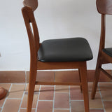 Paire de chaises scandinaves Farstrup en teck avec assise en skaï noir, design danois des années 60.