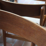 Paire de chaises scandinaves Farstrup en teck avec assise en skaï noir, design danois des années 60.