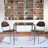 Paire de chaises vintage en chrome tubulaire avec assise et dossier en tissu à motif géométrique.
