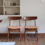 Paire de chaises scandinaves Farstrup en teck avec assise retapissée en tissu terracotta, design danois des années 60.