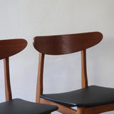 Paire de chaises scandinaves Farstrup vintage en teck et skaï noir neuf