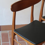 Paire de chaises scandinaves Farstrup vintage en teck et skaï noir neuf