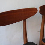 Paire de chaises scandinaves Farstrup vintage en teck et skaï noir neuf