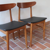 Paire de chaises scandinaves Farstrup vintage en teck et skaï noir neuf