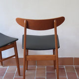 Paire de chaises scandinaves Farstrup vintage en teck et skaï noir neuf