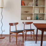 Paire de chaises scandinaves Farstrup vintage en teck et skaï noir neuf