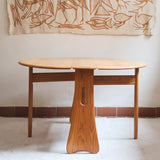 Table Ercol drop leaf en bois massif clair, plateau ovale à abattants, années 70.