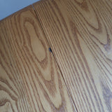 Table Ercol drop leaf en bois massif clair, plateau ovale à abattants, années 70.
