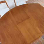 Table à manger ovale extensible en teck, design danois mid century années 60, piètement central et rallonges intégrées