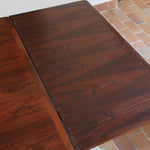 Table à manger scandinave extensible en palissandre, design danois mid-century des années 60, plateau en excellent état.