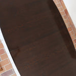 Table à manger Skovby en teck foncé avec plateau noir, piétement traîneau et deux rallonges, design danois des années 70.