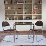 Table vintage en chrome tubulaire avec plateau carré en verre fumé, style années 70.