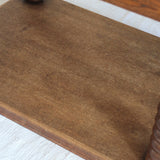 Table à manger vintage en chêne massif, pieds tournés à bobines, socle plein, plateau ouvrant central, art déco rustique esprit Charles Dudouyt