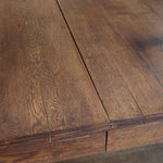 Table à manger vintage en chêne massif, pieds tournés à bobines, socle plein, plateau ouvrant central, art déco rustique esprit Charles Dudouyt