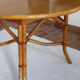 Table à manger ovale extensible bois clair piètement rotin années 70, rallonge centrale, ligatures cuir, jusqu'à 8 couverts