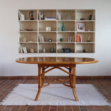 Table à manger ovale extensible bois clair piètement rotin années 70, rallonge centrale, ligatures cuir, jusqu'à 8 couverts