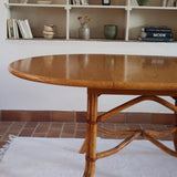 Table à manger ovale extensible bois clair piètement rotin années 70, rallonge centrale, ligatures cuir, jusqu'à 8 couverts