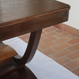 Table de repas Art Déco en chêne, piètement arceau, France, années 30