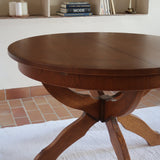 Table ronde vintage à rallonge en chêne massif éditée par Lübke, Allemagne années 60, estampille d'origine sous le plateau, piétement central à quatre jambes plates croisées en X réunies par un moyeu rond, allonge centrale