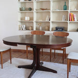 Table à manger ronde extensible vintage, pied central sculptural en étoile à quatre branches, bois foncé, rallonge centrale, design italien années 60