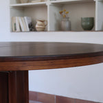 Table ronde extensible Farstrup en palissandre années 70, pied central étoile, fabrication danoise, jusqu'à 10 couverts avec rallonge
